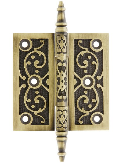 3 1/2 inch Cast Iron Steeple Tip Hinge With Decorative Vine Pattern In Antique Brass